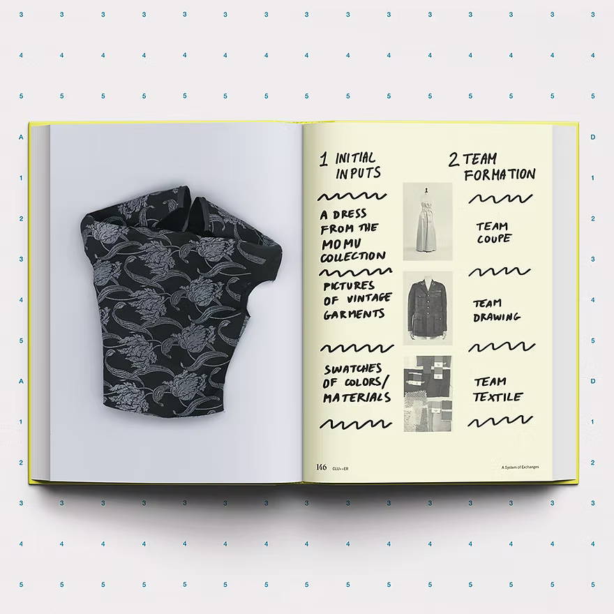 Open book showing a black patterned garment on one page and text on the other, with a white background.